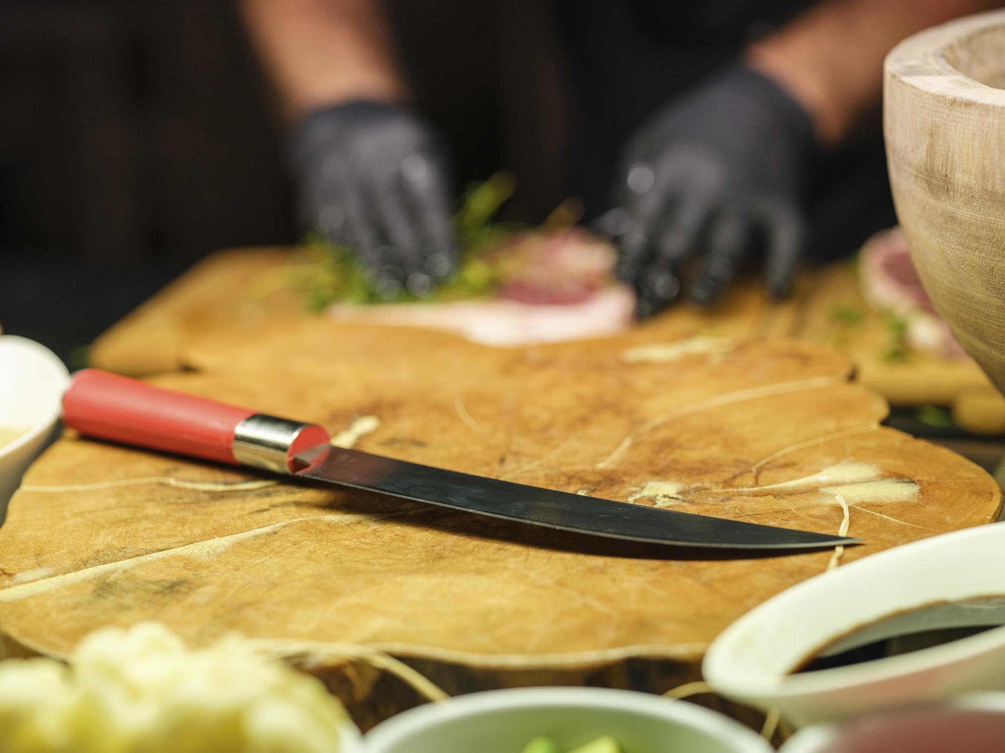 Close-up of precise knife work and mise en place